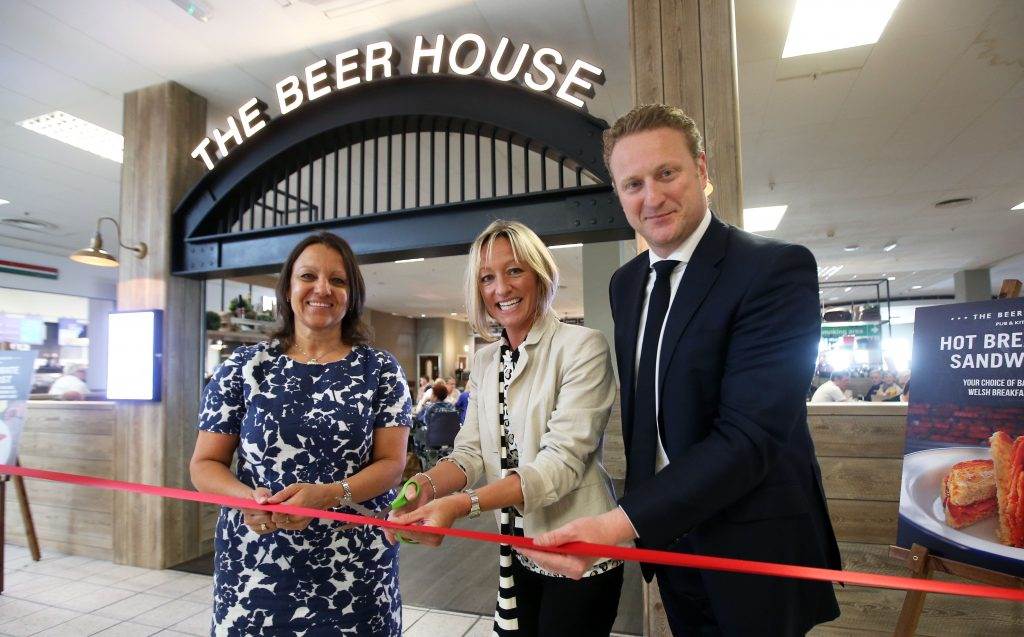 Debra Barber MD & COO Cardiff AIrport, Ruth Wignall cutting the ribbon and Andy Webb Business Development Director SSP The Food Travel Experts