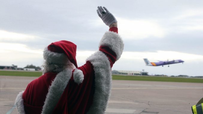 Santa waves passengers off at Cardiff Airport (Image: Cardiff Airport)