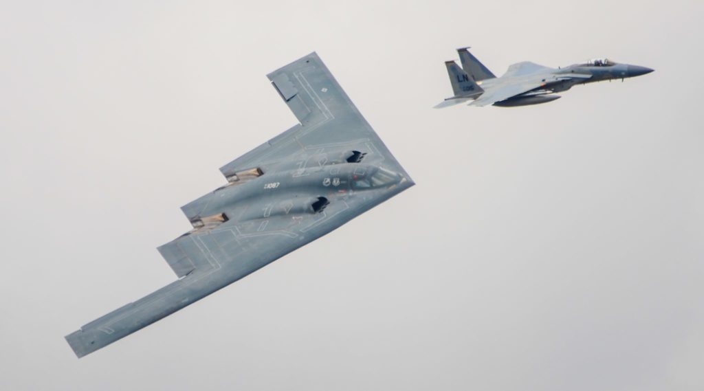 F15 escorting a B2 Stealth Bomber (Max Thrust Digital)