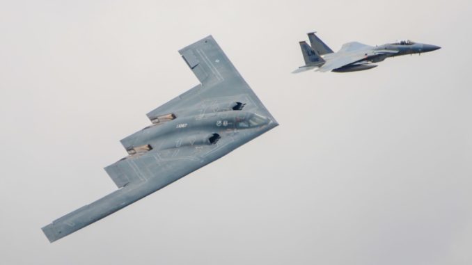 F15 escorting a B2 Stealth Bomber (Max Thrust Digital)