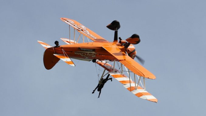 Seeing the world upside down is all in a days work for a wingwalker. (Image : The Aviation Media Co.)