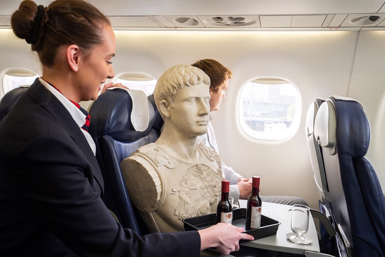 a bust of Ceaser on board British Airways first flight from London City to Rome