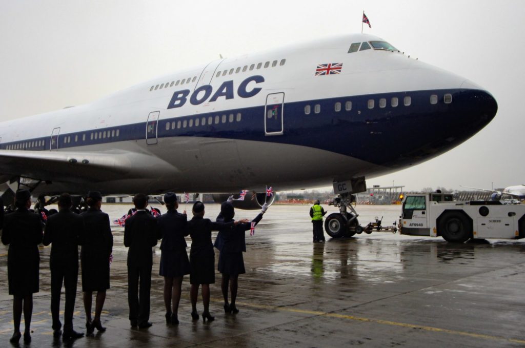 Cabin crew in period and modern uniforms greet BA100 (Image: Aviation Media Co.)