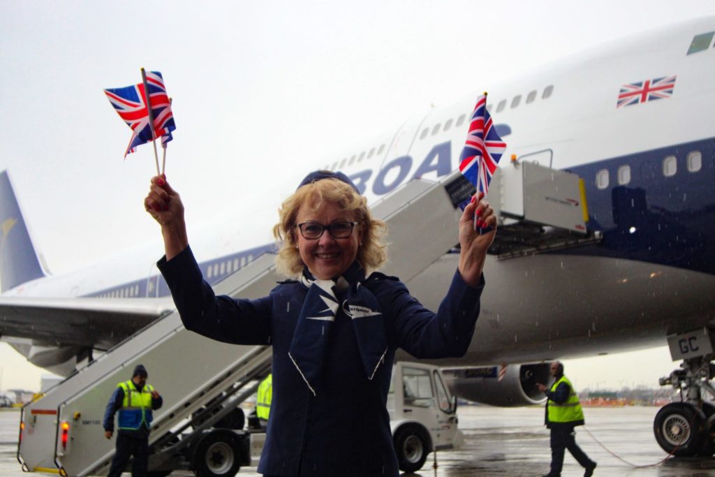 Not even rain could dampen the spirits of former BOAC crew member Linda Morrison (Image: Aviation Media Co.)