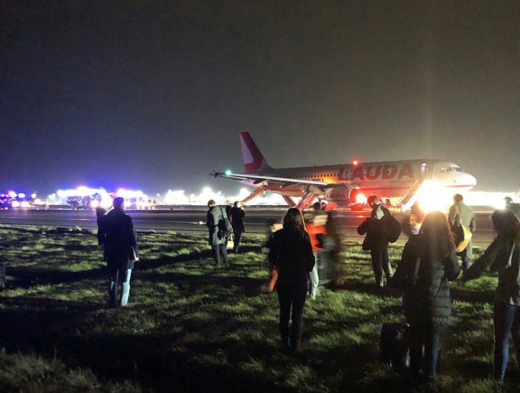 Another image shared widely on Social Media shows passengers evacuated from both sides of the aircraft (Image: Origin Unknown/Twitter)