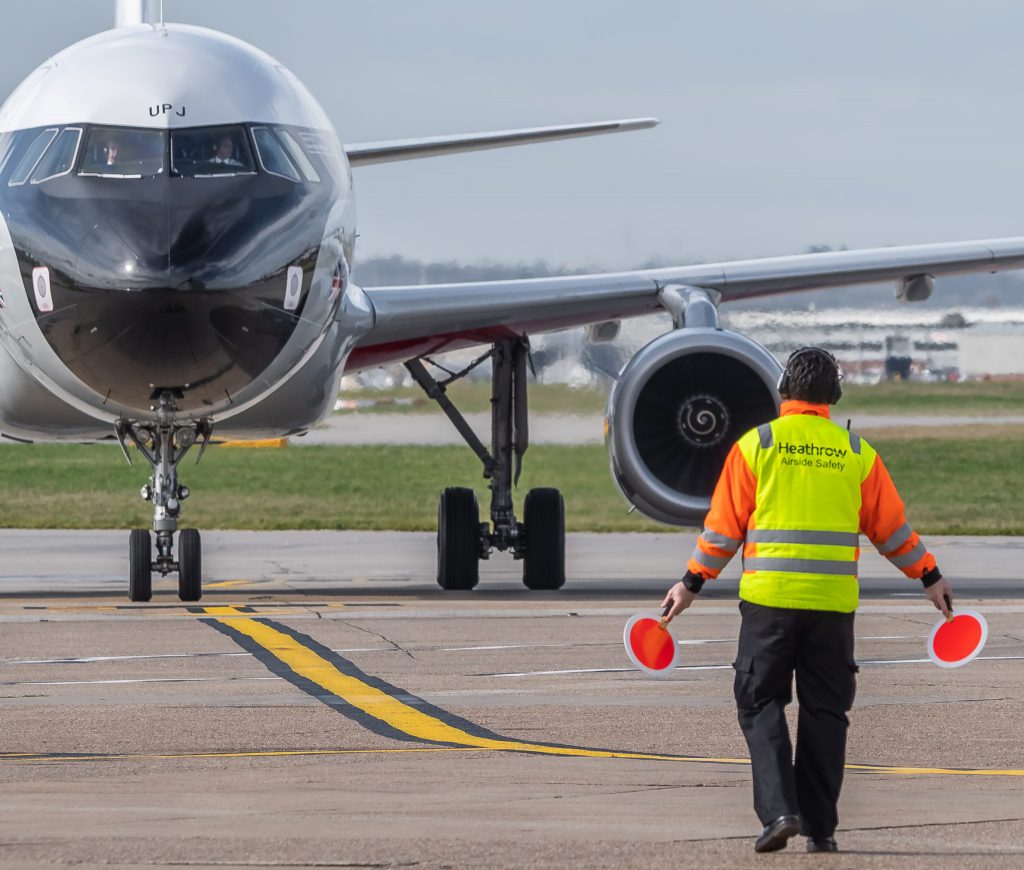 BEA Airbus A319 G-EUPJ gets marshalled into position at Heathrow (Image: Jamie Woodhouse-Wright/Aviation Media Co.)