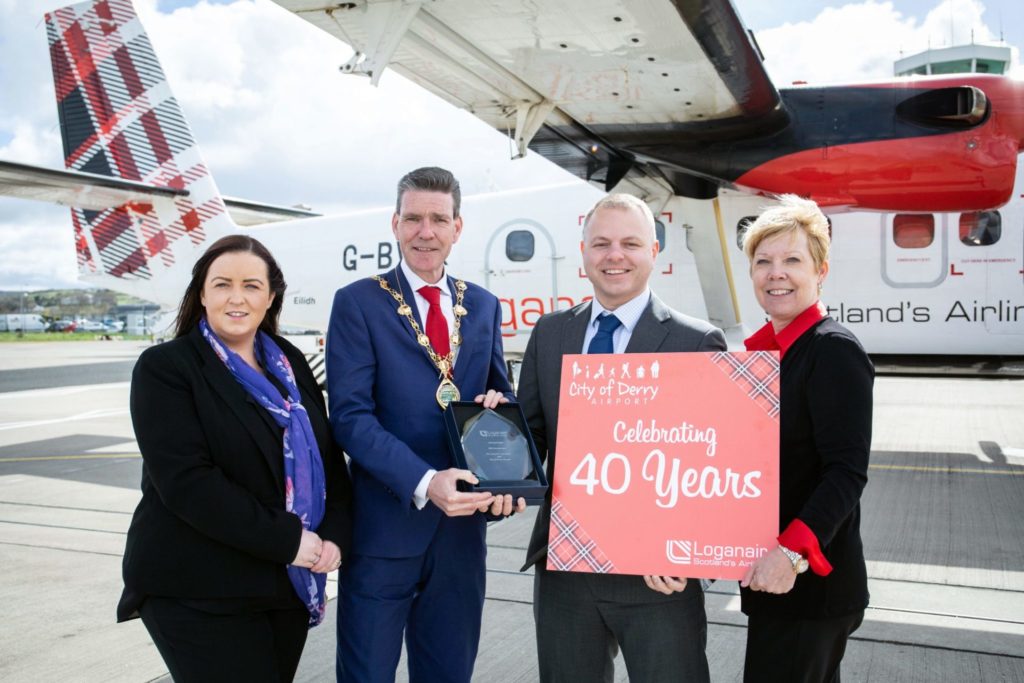 City of Derry Airport manager Charlene Shongo, Derry Mayor John Boyle, Loganair managing director Jonathan Hinkles, Loganair commercial director Kay Ryan in front of Twin Otter.