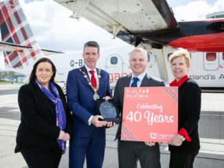 City of Derry Airport manager Charlene Shongo, Derry Mayor John Boyle, Loganair managing director Jonathan Hinkles, Loganair commercial director Kay Ryan in front of Twin Otter.
