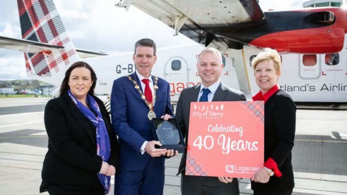 City of Derry Airport manager Charlene Shongo, Derry Mayor John Boyle, Loganair managing director Jonathan Hinkles, Loganair commercial director Kay Ryan in front of Twin Otter.