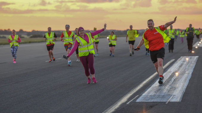 Hundreds run on Luton Airport's runway for Macmillan Cancer Support