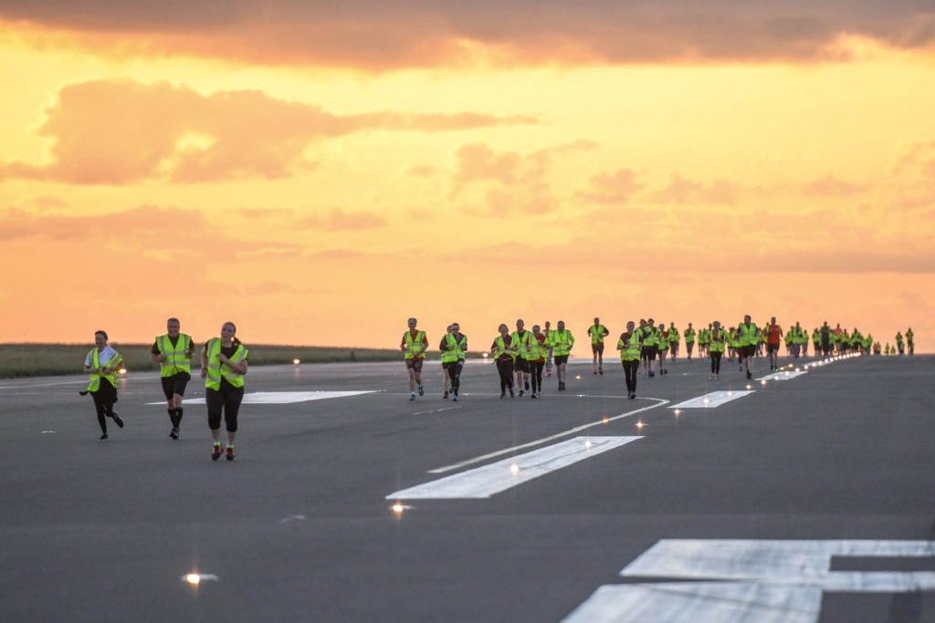 Hundreds run on Luton Airport's runway for Macmillan Cancer Support