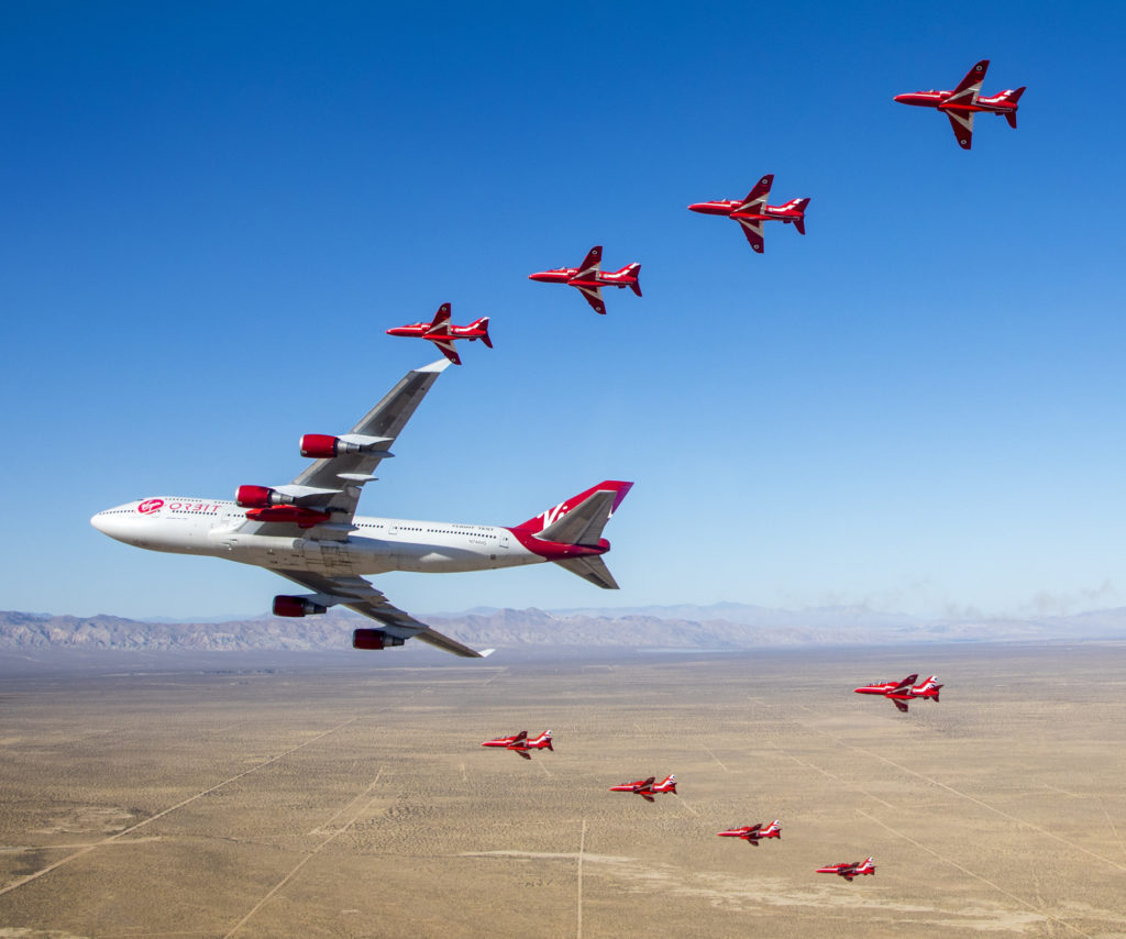 The Red Arrows iconic Red Hawks fly in formation with Virgin Orbit's Boeing 747 Cosmic Girl (©Crown Copyright 2019)