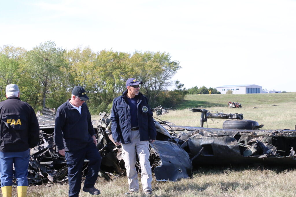 NTSB Member Michael Graham & NTSB Investigator-in-Charge Jason Aguilera walks the accident scene of the Nov. 12, mid-air collision between a Boeing B-17G and a Bell P-63F near Dallas, Texas.