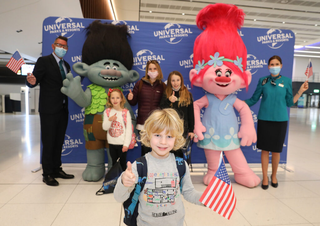 Pictured are Rachel Charlesworth, Annie Charlesworth (10), Flecity Charlesworth (6) and Elliott Charlesworth (4) from Stoke, with Universal Studios Shrek and Trolls characters at check-in for the Aer Lingus UK inaugural flight from Manchester Airport direct to Orlando.