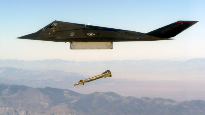 An F-117 Nighthawk engages its target and drops a GBU-28 guided bomb unit during the 'live-fire' weapons testing mission COMBAT HAMMER, at Hill Air Force Base, Utah. (Public Domain)