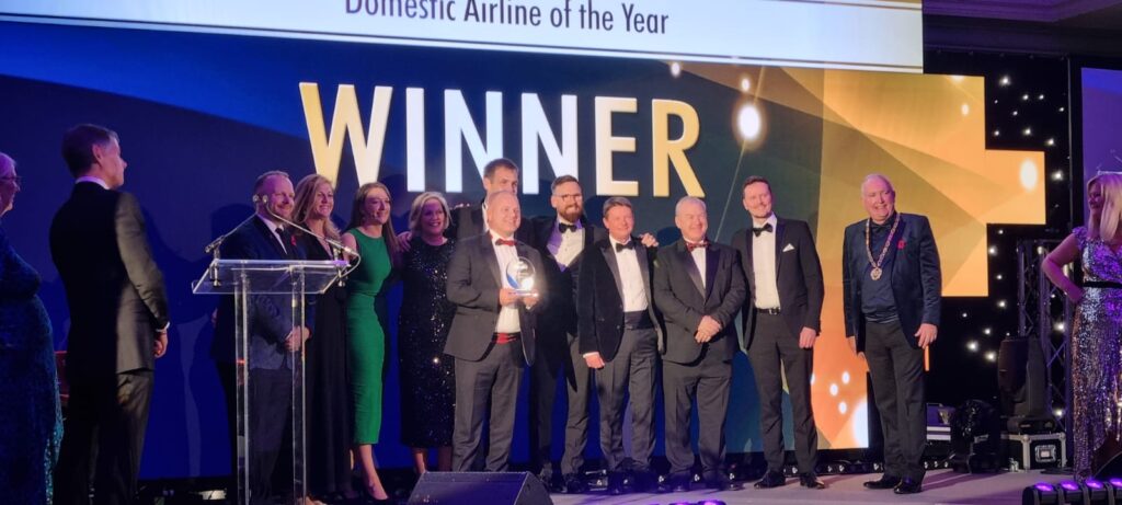 Loganair team collecting Domestic Airline of the Year Award