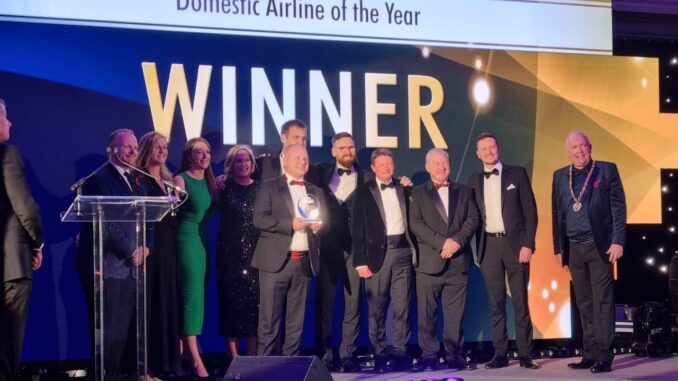 Loganair team collecting Domestic Airline of the Year Award