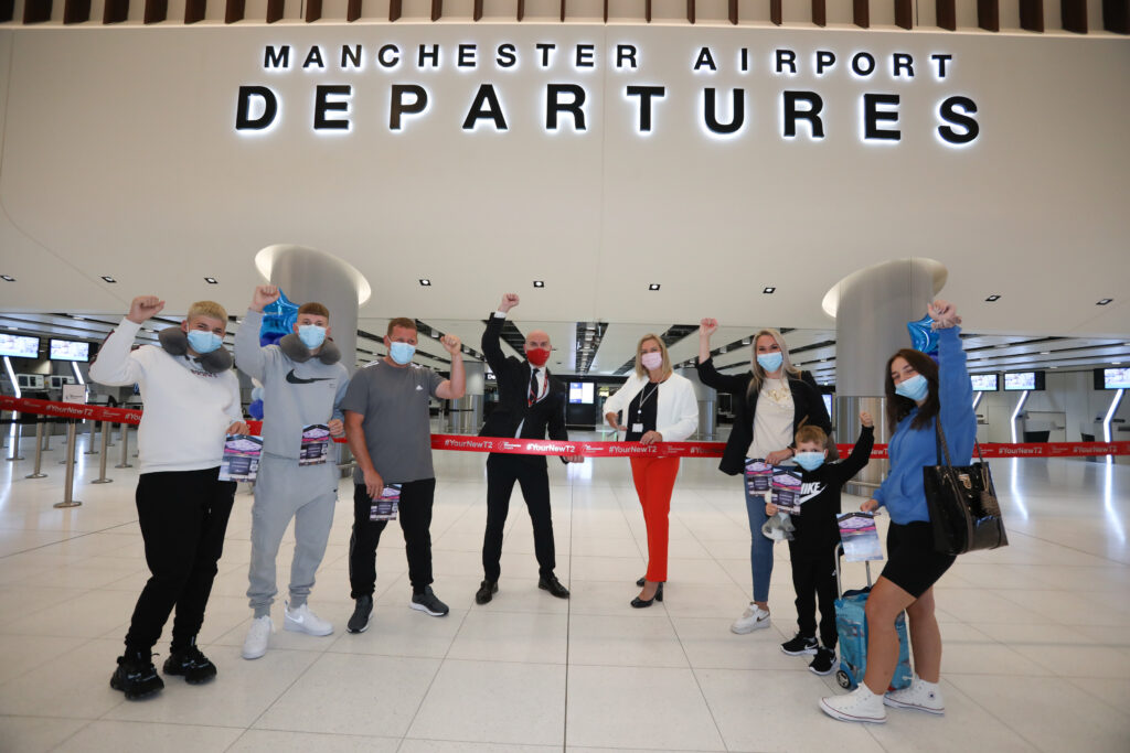 Marc Burns Jet2 and Karen Smart Manchester Airport with the Thompson family at Manchester Airports new Terminal Two