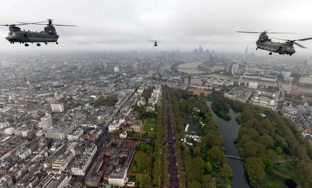 Image of two chinook (left and right) and a Puma (centre) helicopter from RAF Odiham are seen here during their flypast over London. 
(Image: Crown Copyright 2023)